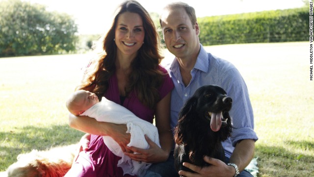 In August, Catherine and William pose with George and their dogs Lupo, right, and Tilly in the garden of Catherines family home in Bucklebury, England.