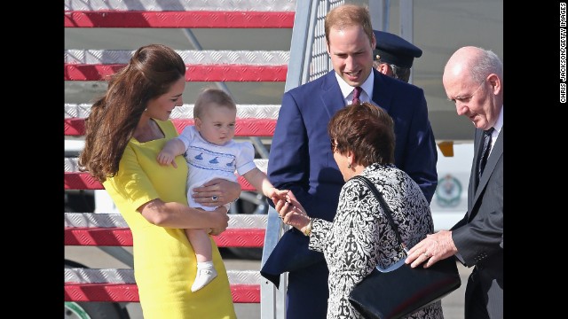 George shakes hands with Lynne Cosgrove, the wife of Australias governor-general, on the tarmac of Sydney Airport on April 16.