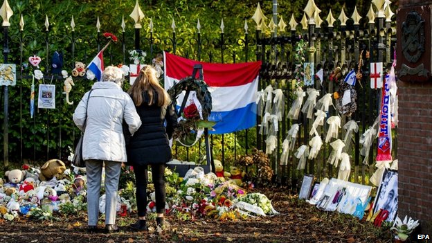 Soft toy animals and floral tributes are left in commemoration for the victims of MH17 at the Korporaal van Oudheusdenkazerne in Hilversum, The Netherlands 