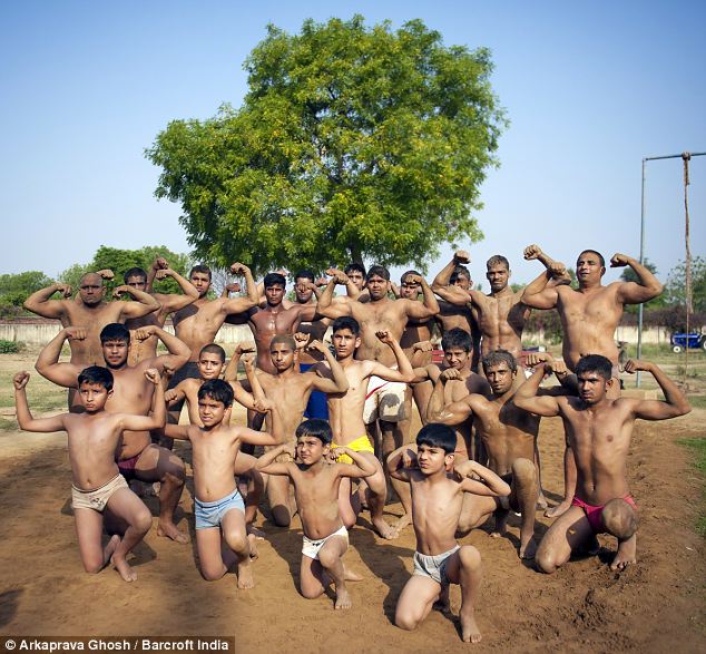 Trainees pose for a group photo at the akhara. With more youngsters craving lean, fashion model-like muscles, the villages reputation as a breeding ground for beefcakes is now under threat