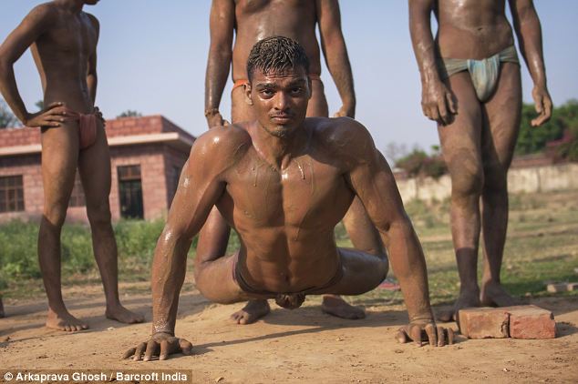 A wrestler does push ups at Asolas akhara. Traditional skills are important to the bouncers, who work unarmed