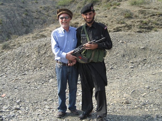 Donald Parrish poses with a Pakistani Soldier in Khyber Pass in 2006. Mr Parrish has visited 840 of the worlds 875 recognised destinations