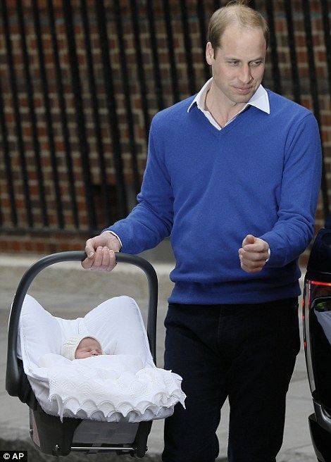 William carries his new baby daughter in her car seat
