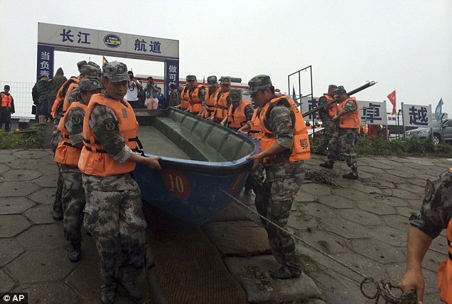 Strong rains and winds are said to be hampering the huge search effort, local media reported