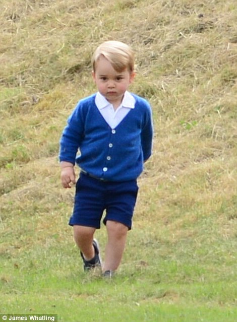 George, who is becoming a fashion icon in his own right was dressed in an £64 Olivier cardigan and black Crocs, £26.99