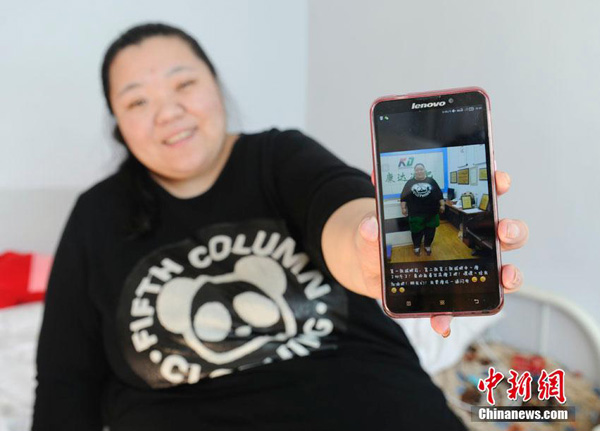 Liu cho phóng viên xem bức ảnh trong điện thoại chụp cô khi chưa giảm cân.
