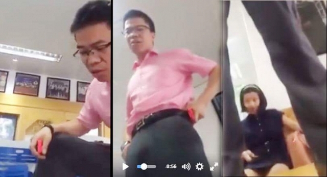
Tiến sỹ Phan Văn Hưng có hành động đứng lên bàn dùng lời lẽ thô tục chửi học sinh. Ảnh: Cắt từ clip
