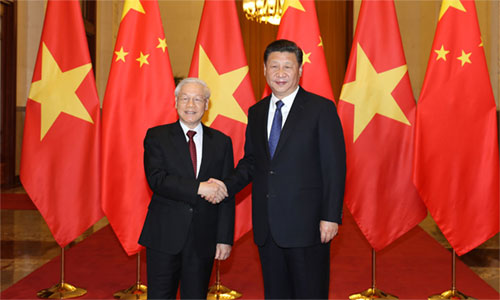 Chủ tịch Trung Quốc Tập Cận Bình đón Tổng Bí thư Nguyễn Phú Trọng. Ảnh: TTXVN