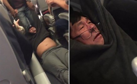 
Bác sỹ người Mỹ gốc Việt David Dao bị các nhân viên an ninh cưỡng chế ra khỏi máy bay của hãng United Airlines.
