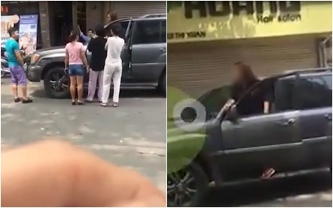 Sau va chạm, cả hai đứng tranh c&atilde;i gay gắt giữa phố. Ảnh cắt từ clip