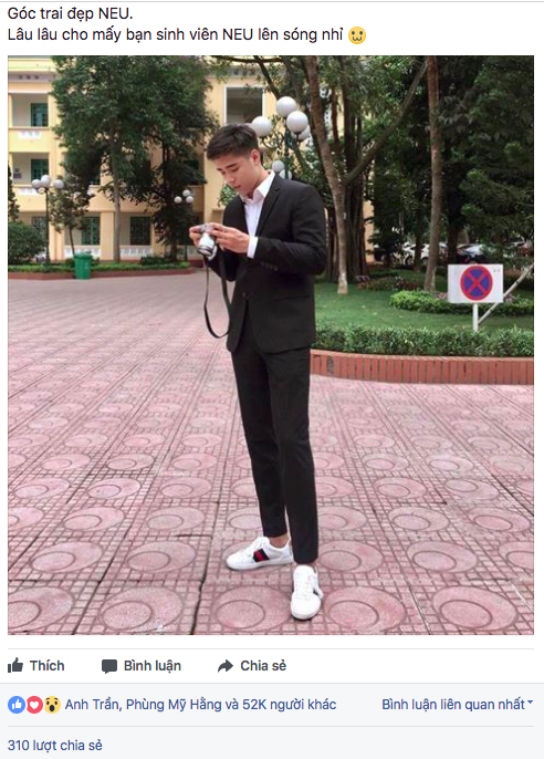 Bức ảnh mặc suit chụp kỉ yếu của Minh Hoàng khá hot trên fanpage NEU Confession