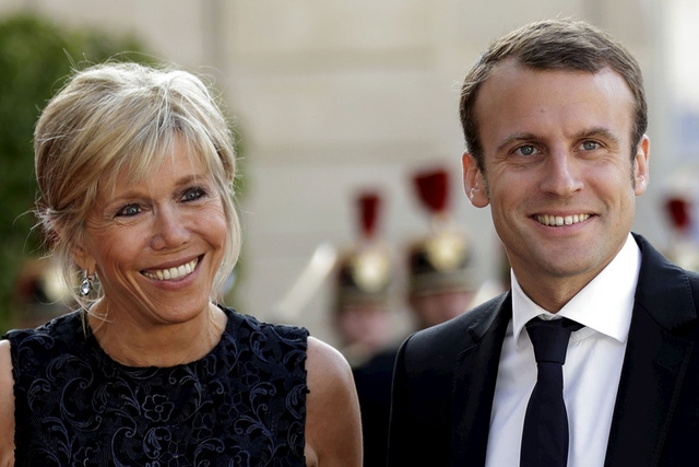 Tổng thống Pháp Emmanuel Macron và vợ (Ảnh: Reuters)