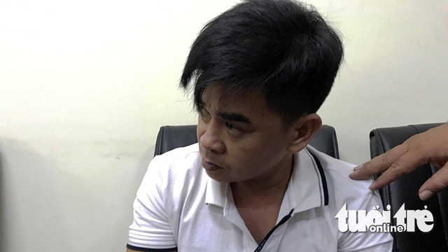 Nghi can Nguyễn Quốc Huy tại cơ quan điều tra - Ảnh: GIA MINH