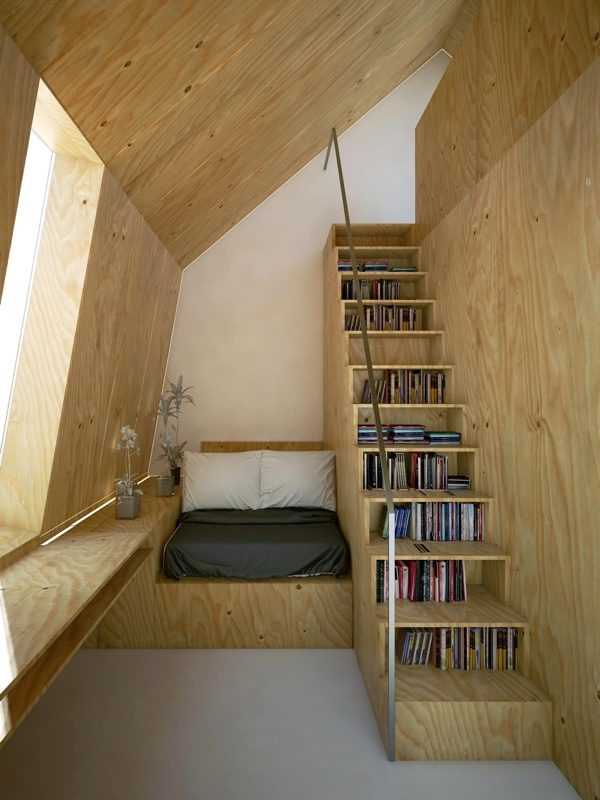 14. Thiết kế này sử dụng 1 góc nhỏ với giường cạnh cầu thang. Xen kẽ giữa mỗi bậc là 1 hàng sách trang trí, toàn bộ căn phòng được bao quanh bởi gỗ tạo nên cảm giác vô cùng ấm áp.