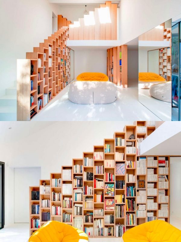 6. Thư viện nhỏ trong nhà này có những ô chứa sách đáng yêu. Bức tường và sàn màu trắng kết hợp với tấm gương và 2 chiếc ghế ở giữa góp phần hoàn thành không gian đọc sách vô cùng thu hút.
