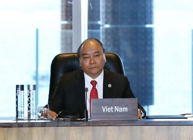 Thủ tướng Nguyễn Xuân Phúc dự Đối thoại giữa các Nhà lãnh đạo kinh tế APEC với Quỹ Tiền tệ Quốc tế. (Ảnh: Thống Nhất/TTXVN)