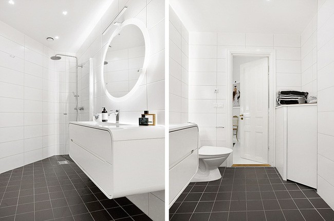 Thiết bị và hệ thống đèn chìm mang tới vẻ đẹp hiện đại, vô cùng ấn tượng cho không gian nhà tắm của căn hộ này.