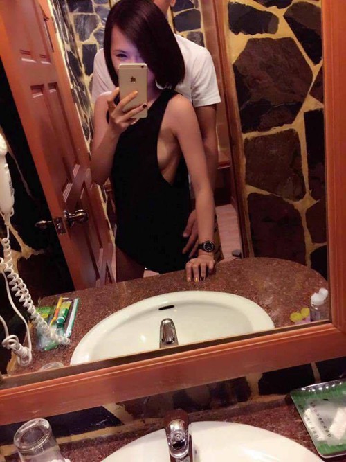 Chồng của Amanda, Feng Long, ôm cô gái lạ không mặc áo ngực ở một khách sạn tại Phuket tuần trước. Ảnh: The Coverage.