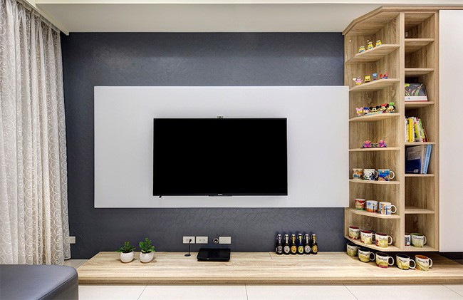 Góc nhỏ phòng khách đẹp ấn tượng với hệ thống kệ kết hợp tủ.