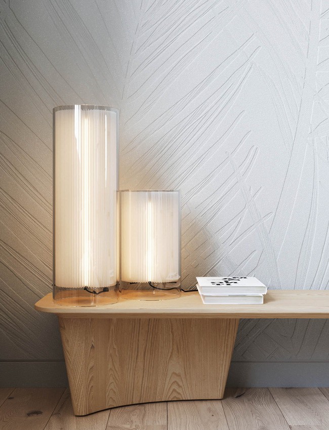 Bàn điều khiển bên dưới tivi có thiết kế kệ gỗ lưu trữ hình học uốn lượn.