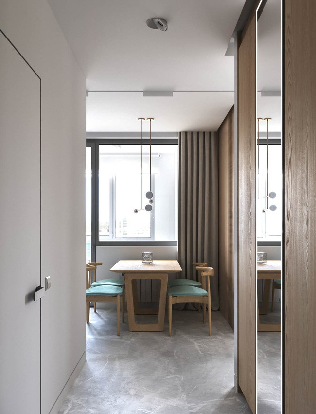 Màu xanh nước biển và tông màu gỗ được thống nhất từ phòng khách vào đến đây.