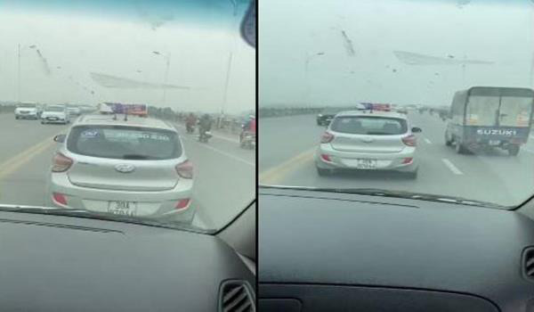 Tài xế taxi nghênh ngang cản đường xe cấp cứu trên cầu Vĩnh Tuy - Ảnh 1.