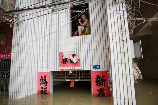 Lũ Trung Quốc: Mực nước 33 con sông chạm mốc kỉ lục, 141 người chết và mất tích - Ảnh 10.
