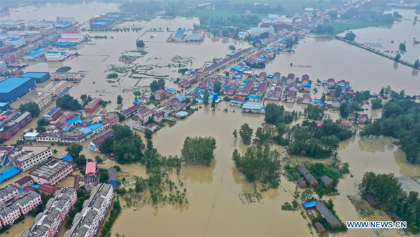 Con số lột tả sức tàn phá khủng khiếp của trận mưa lũ hiếm gặp tại Trung Quốc - Ảnh 3.