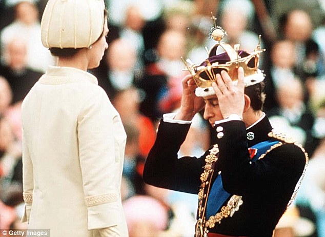 Thats better: Charles adjusts the coronet to his liking after his mother placed it upon his head