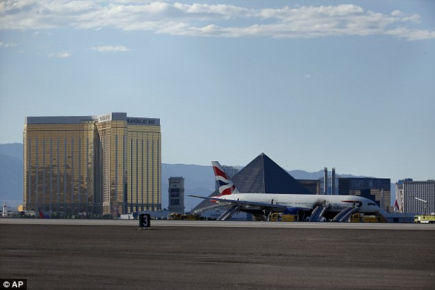 The Mandalay Bay hotel and the pyramid of the Luxor are seen on the horizon at one end of the strip 