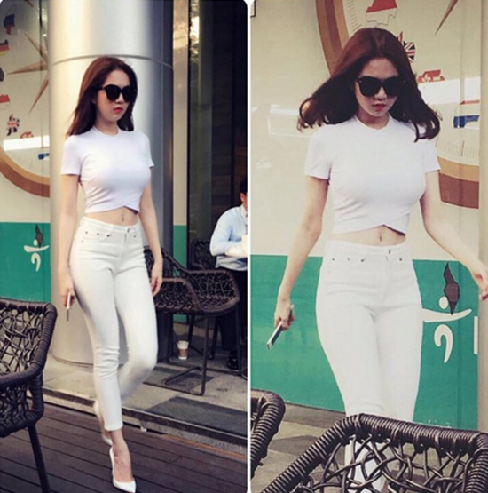 Ngọc Trinh chọn nguyên một cây trắng bao gồm áo phông dáng crop top và quần skinny, giày cao gót.