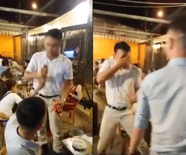 Khi phát hiện người này hát nhép, nam thanh niên đã hất cả cốc bia vào mặt chàng trai - (Ảnh cắt từ clip).