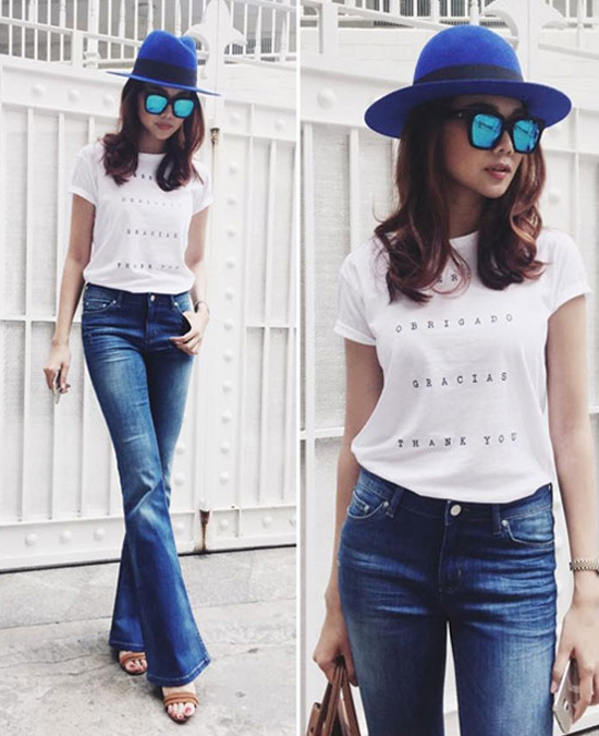 Thanh Hằng thể hiện chất thời trang càng đơn giản càng đẹp. Quần jeans ống loe được cô mix ăn ý cùng áo phông trắng họa tiết chữ nhỏ để phô diễn đôi chân dài miên man.