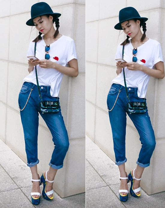 Ninh Dương Lan Ngọc cá tính, tinh nghịch khi diện quần jeans xắn gấu và áo phông trắng phối, đôi sandal nổi bật.