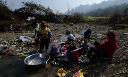 
Hàng triệu người Trung Quốc vẫn đang sống trong tình trạng đói nghèo. Ảnh: AFP.
