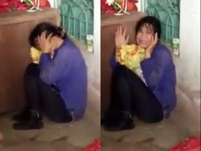 Hình ảnh người phụ nữ sợ hãi khi người dân phát hiện. Ảnh cắt từ clip