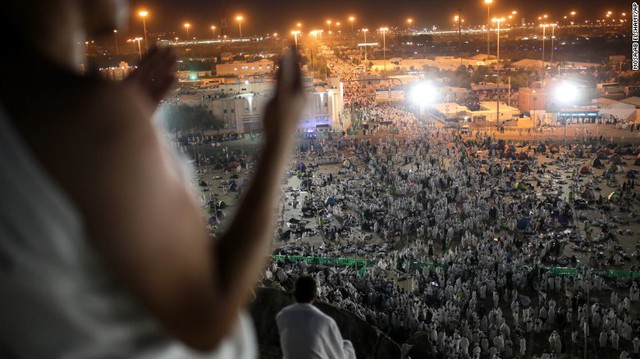 Muslim pilgrims pray on a rocky hill called the Mountain of Mercy, on the plain of Arafat. Islam requires every Muslim who is physically and financially able to make the journey to Mecca at least once in his or her lifetime.
