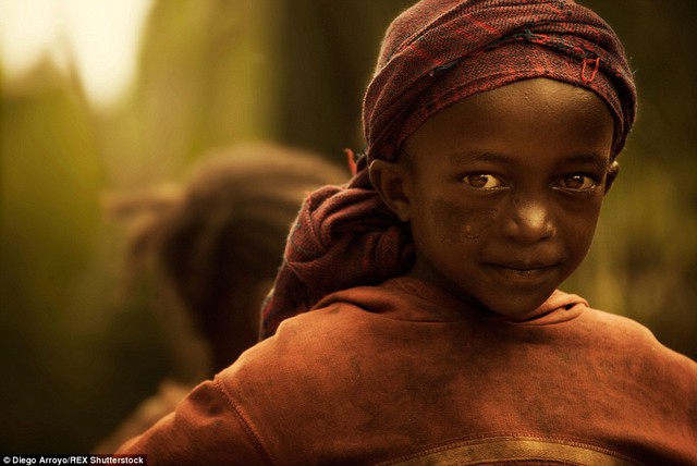 Traditional: A young girl in a headscarf. Spanish photographer Diego Arroyo Méndez captured this series of stunning images of village life in Ethiopia, where cultures have been well-preserved and traditions honoured