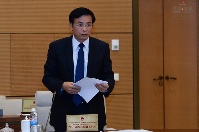 Ông Nguyễn Hạnh Phúc trình bày tờ trình chuẩn bị cho kỳ họp thứ nhất Quốc hội khóa XIV. Ảnh: quochoi.vn