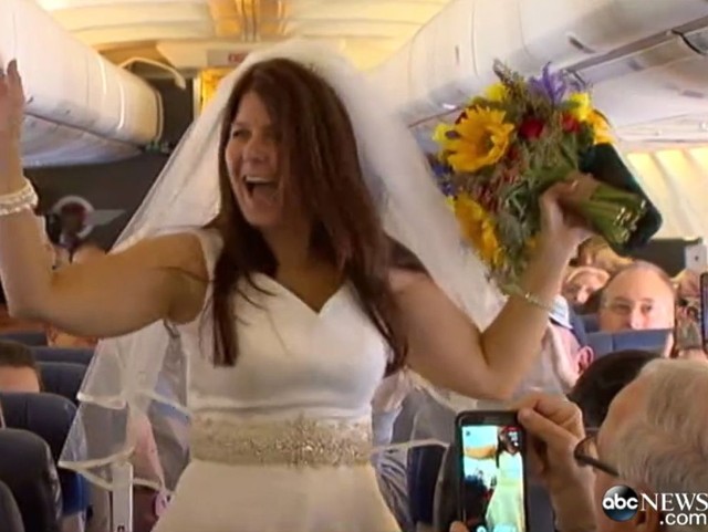 Dottie Coven dances down the aisle for her wedding on a Southwest Airlines flight, Nov. 2, 2014.