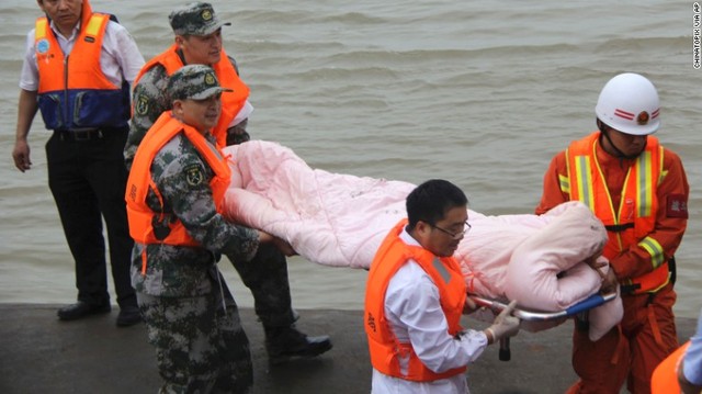 Rescue workers carry a survivor from the hull of the ship on June 2.