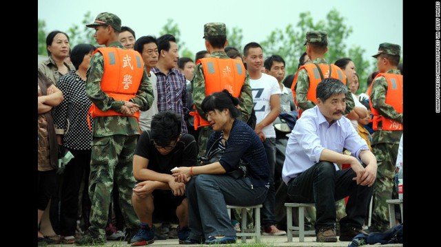 Relatives of passengers await news in Jingzhou, China, on June 3.