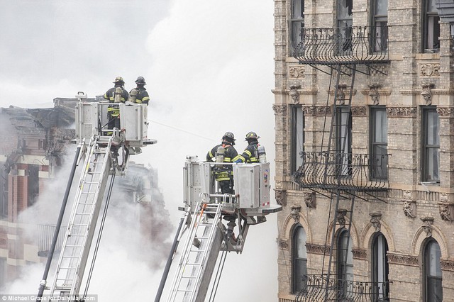High above the city: Fire responders on the scene working to get a massive blaze under control in East Village 