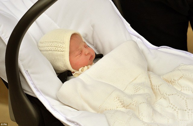 The newborn managed to sleep through cheers and flashbulbs as she was proudly shown off for the very first time yesterday afternoon