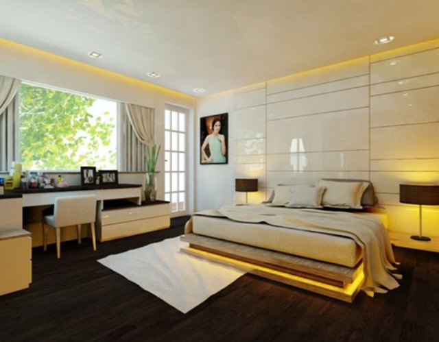 Phòng ngủ ấm cúng với tone màu trắng và ánh đèn vàng hắt từ trần nhà và xung quanh giường