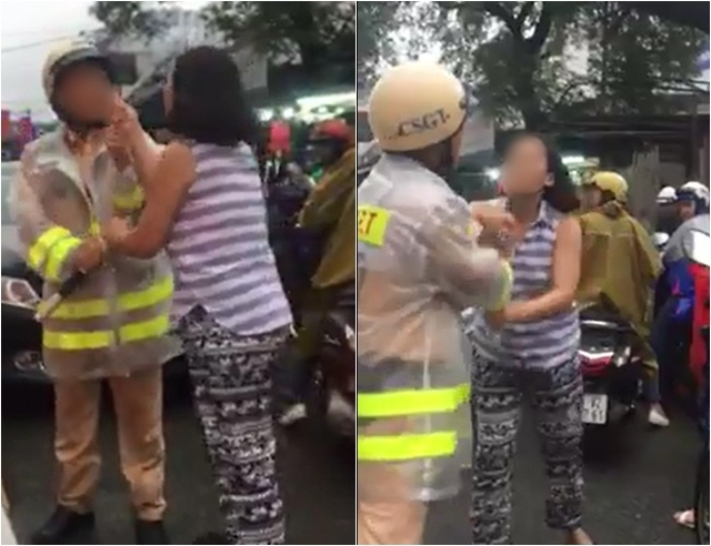 Người phụ nữ chửi bới chiến sĩ cảnh sát đang làm nhiệm vụ sau khi vi phạm giao thông. Ảnh cắt từ clip.