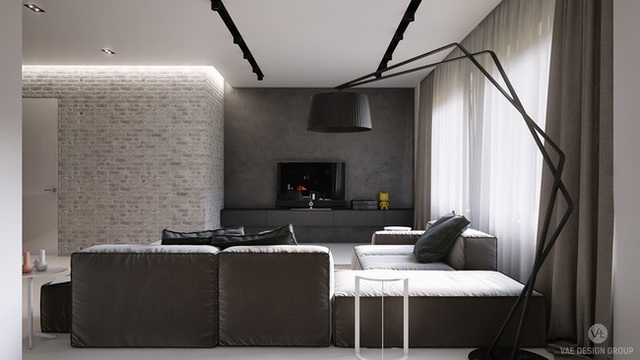 
14. Màu trắng của sàn và trần tường phản với các đồ nội thất tối màu trong phòng khách này, chiếc đèn có thiết kế lạ mắt là điểm nhấn đáng chú ý.
