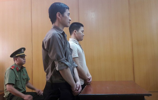 
Hia bị cáo Lu Lei và Zhang Qiyu tại tòa.
