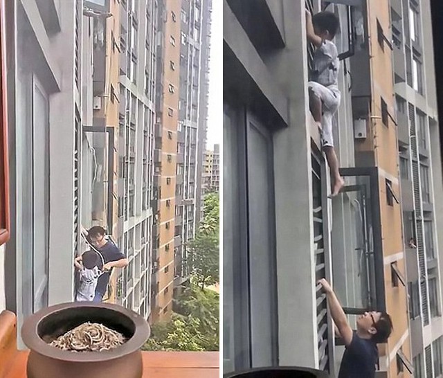 Cậu b&eacute; được bố v&ograve;ng d&acirc;y thừng v&agrave;o người v&agrave; hỗ trợ từ b&ecirc;n dưới. Ảnh: AsiaWire.