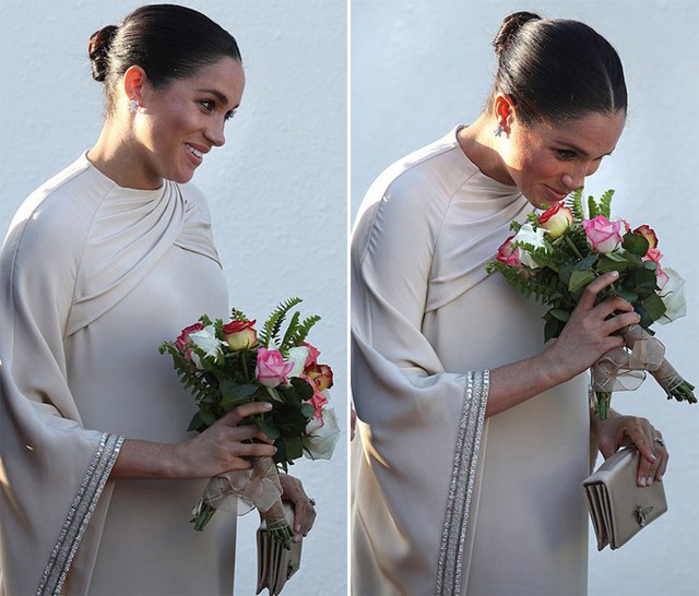 Meghan tỏ ra vui thích và hít hà những bông hoa theo phong cách của các công chúa.